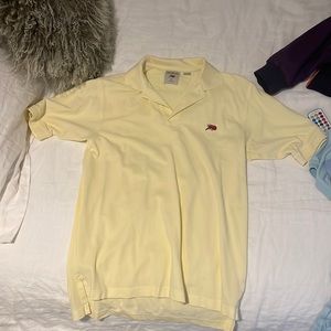 Yellow polo shirt. (Perlis)